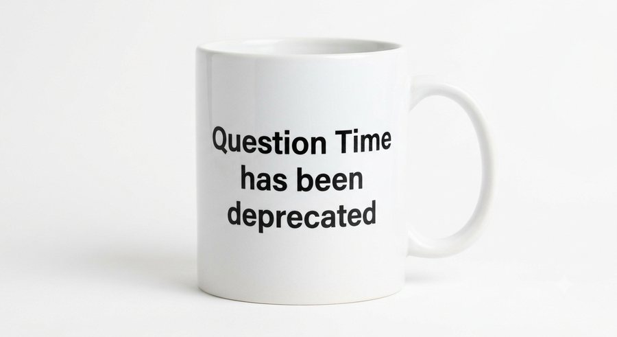 White mug reading “Question Time has been deprecated”