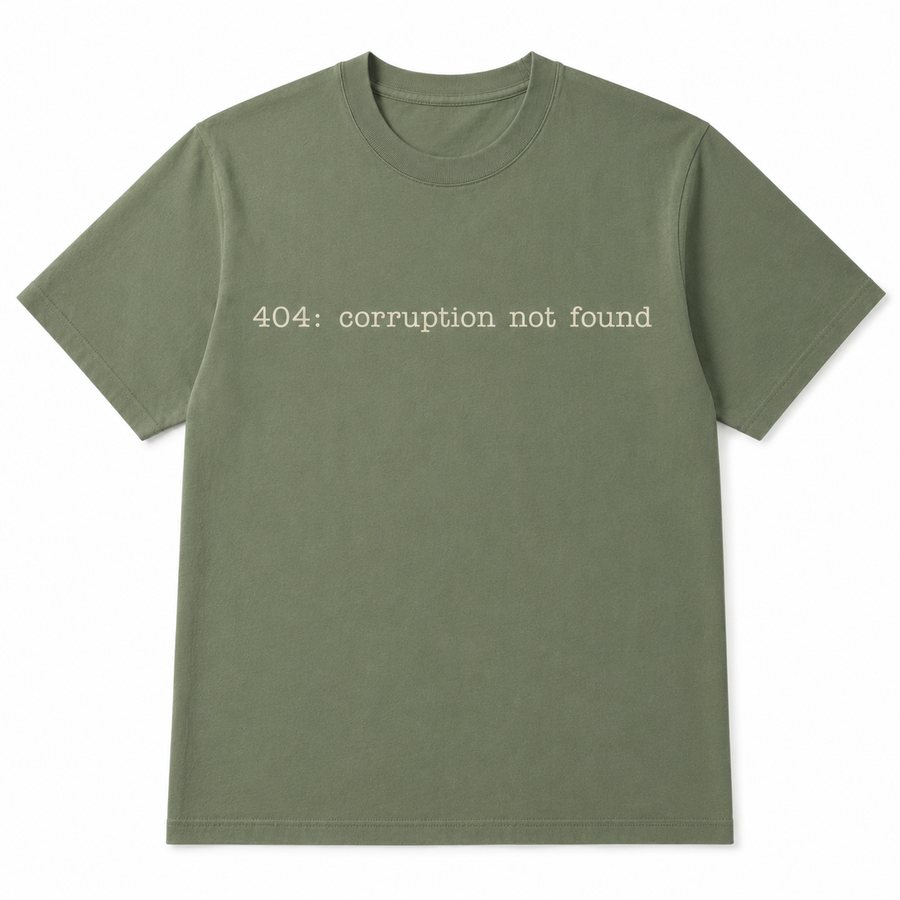 Olive green t-shirt reading “404: corruption not found”